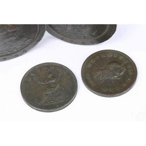 205 - A collection of four British King George III coins to include two 1797 cartwheel two pence coins.