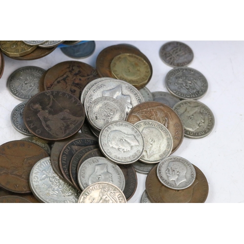 102 - A collection of British pre decimal coins to include a good selection of pre 1947 silver examples to... 