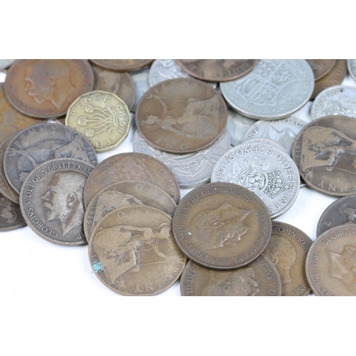 102 - A collection of British pre decimal coins to include a good selection of pre 1947 silver examples to... 