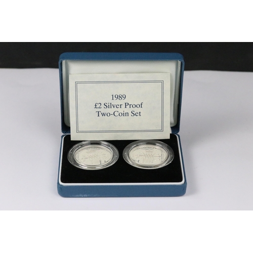 108 - A collection of three Royal Mint silver proof coin sets to include the 1989 £2 coin two coin set, 19... 