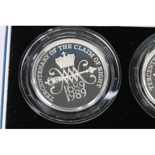 108 - A collection of three Royal Mint silver proof coin sets to include the 1989 £2 coin two coin set, 19... 