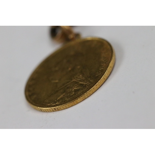 111 - A British Queen Victoria 1887 gold half sovereign coin mounted to small length of 9ct gold chain.