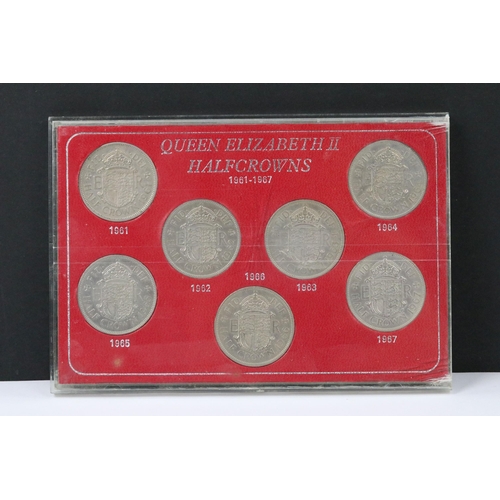 121 - A collection of coin sets to include Queen Elizabeth sixpences, Queen Elizabeth crowns, Queen Elizab... 