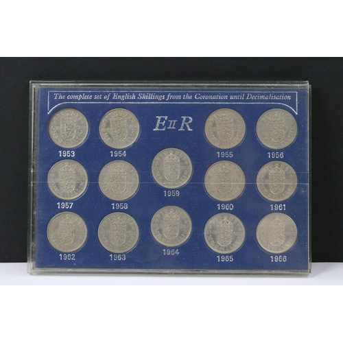 121 - A collection of coin sets to include Queen Elizabeth sixpences, Queen Elizabeth crowns, Queen Elizab... 