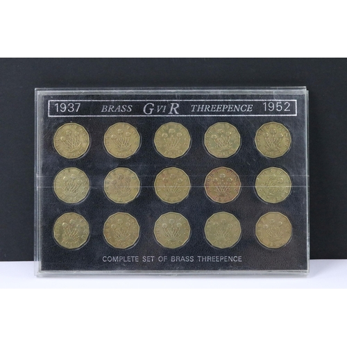 121 - A collection of coin sets to include Queen Elizabeth sixpences, Queen Elizabeth crowns, Queen Elizab... 