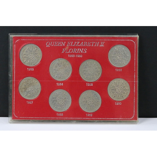 121 - A collection of coin sets to include Queen Elizabeth sixpences, Queen Elizabeth crowns, Queen Elizab... 