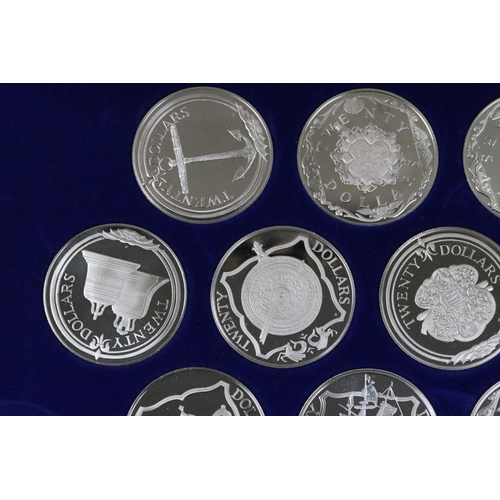 129 - The Treasure coins of the Caribbean twenty five silver proof coin set, within original fitted displa... 