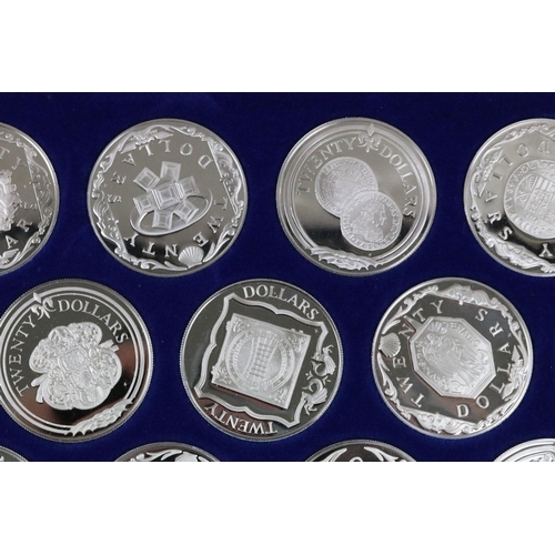 129 - The Treasure coins of the Caribbean twenty five silver proof coin set, within original fitted displa... 