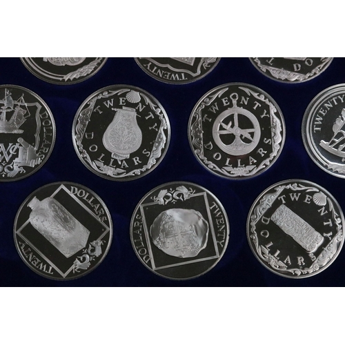 129 - The Treasure coins of the Caribbean twenty five silver proof coin set, within original fitted displa... 