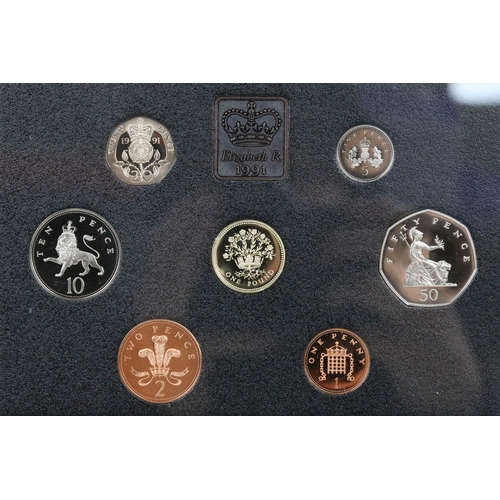 139 - A collection of four Royal Mint brilliant uncirculated coin year sets to include 1984, 1991, 1986 an... 