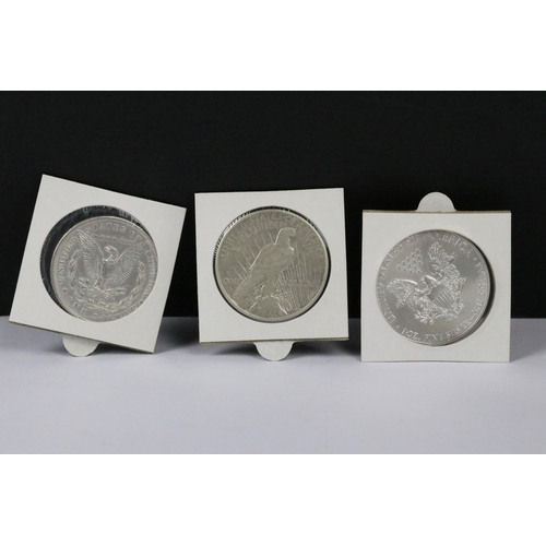 145 - A collection of three American silver dollars to include 1885, 1926 and 2014 examples.