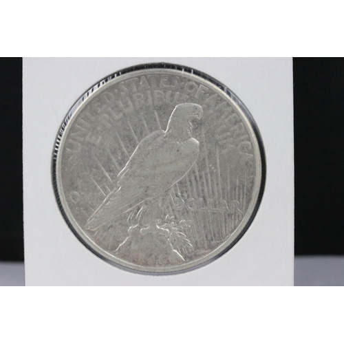 145 - A collection of three American silver dollars to include 1885, 1926 and 2014 examples.