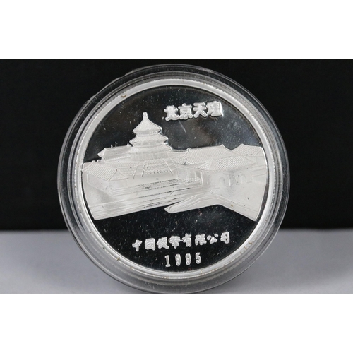 148 - A collection of twelve Chinese new year collectors coins encapsulated and contained within a two tie... 