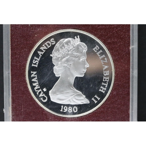 166 - Two Queen Elizabeth II Cayman Islands 1980 $25 silver proof coins encapsulated within cases.