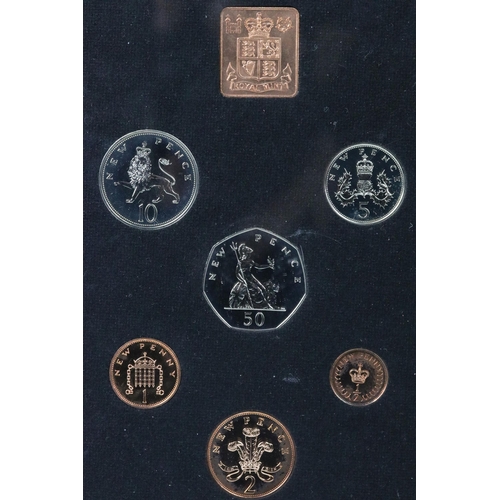 169 - A collection of eight Royal Mint brilliant uncirculated coin sets to include Gilbert Islands, Bhutan... 