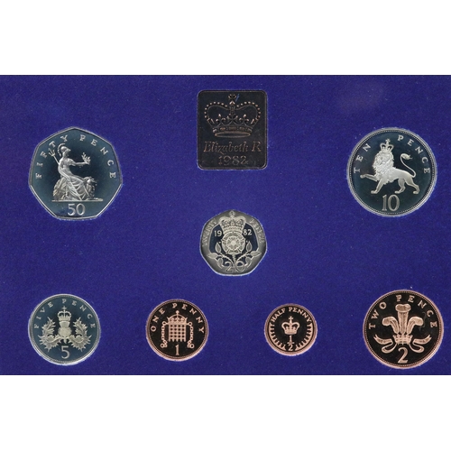 169 - A collection of eight Royal Mint brilliant uncirculated coin sets to include Gilbert Islands, Bhutan... 