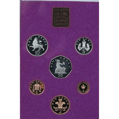 169 - A collection of eight Royal Mint brilliant uncirculated coin sets to include Gilbert Islands, Bhutan... 