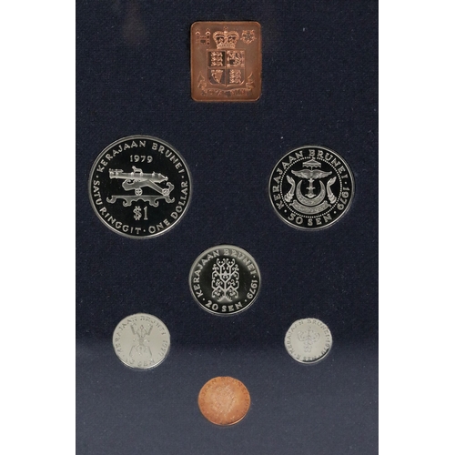 169 - A collection of eight Royal Mint brilliant uncirculated coin sets to include Gilbert Islands, Bhutan... 