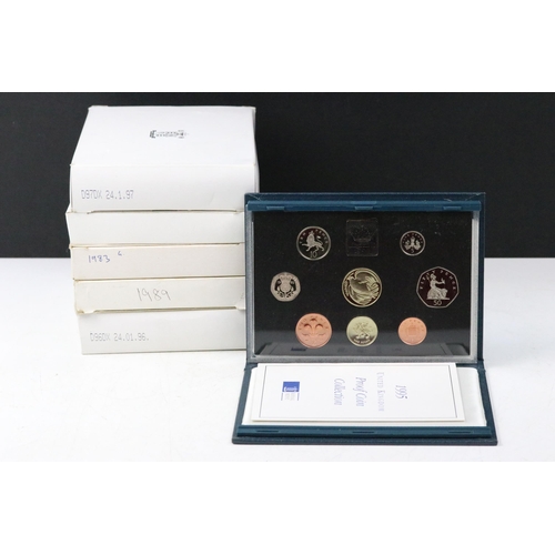 54 - A collection of six Royal Mint annual coin year sets to include brilliant uncirculated and proof exa... 