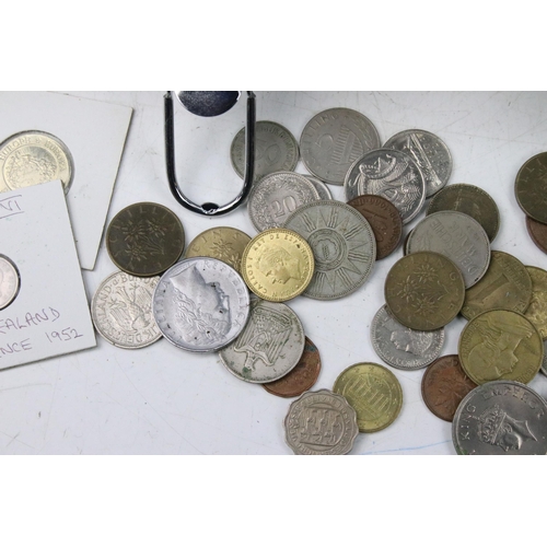 61 - A collection of mixed world / foreign coins contained within an aluminium coin collectors case.