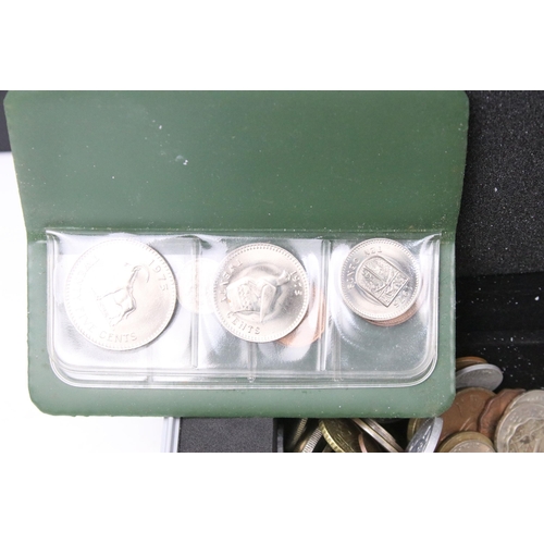 61 - A collection of mixed world / foreign coins contained within an aluminium coin collectors case.