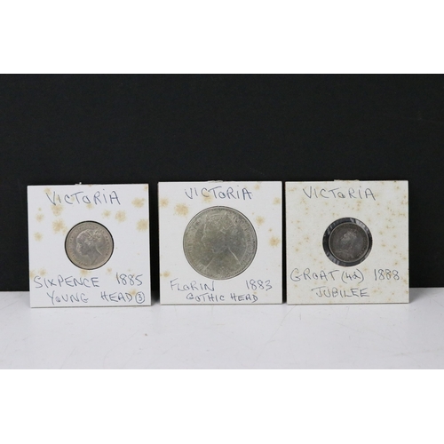 77 - A collection of British Queen Victoria pre decimal silver coins to include half crowns, gothic flori... 