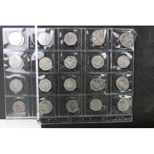 81 - A large collection of British Queen Elizabeth II collectors 50p and £2 coins contained within an alu... 