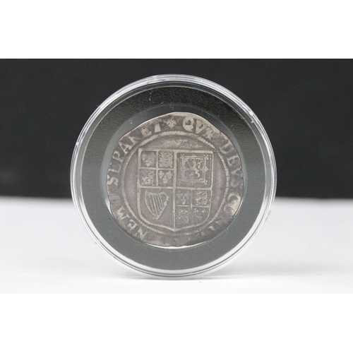 87 - A British hammered silver King James 1st (1604-1625) shilling coin, encapsulated within fitted displ... 