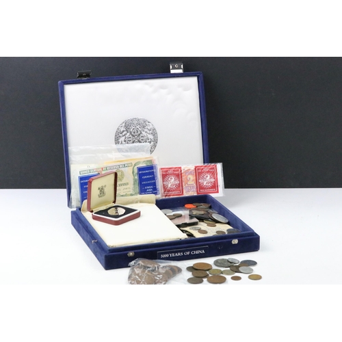 91 - A small collection of British pre decimal, decimal and world coins to include an early Arabic exampl... 