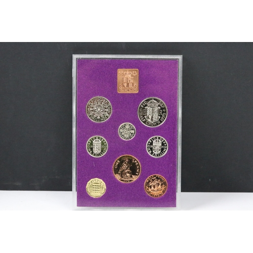 91 - A small collection of British pre decimal, decimal and world coins to include an early Arabic exampl... 