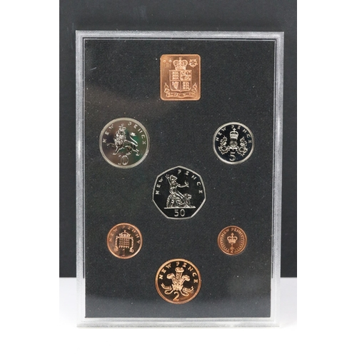 91 - A small collection of British pre decimal, decimal and world coins to include an early Arabic exampl... 