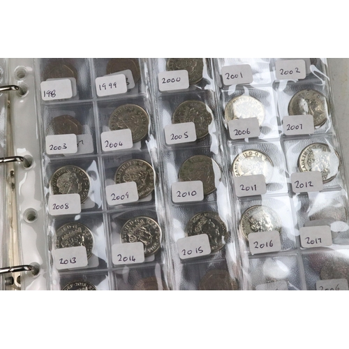 252 - A collection of British decimal coins contained within three collectors folders to include a selecti... 