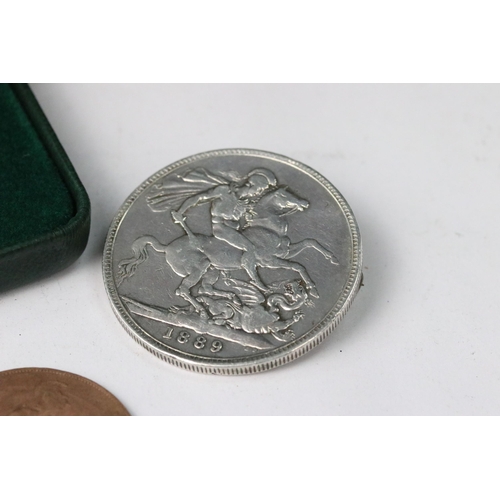 253 - A Royal Canadian Mint silver dollar coin encapsulated within fitted display case together with a Que... 