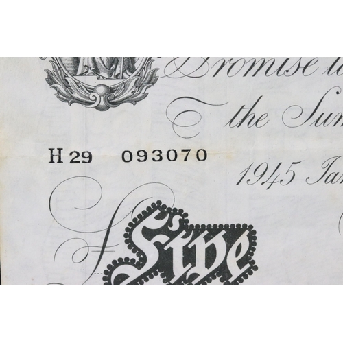 37 - A Bank of England white five pound note, Jan 30th 1945, K.P Peppiatt, serial No H 29 093070.