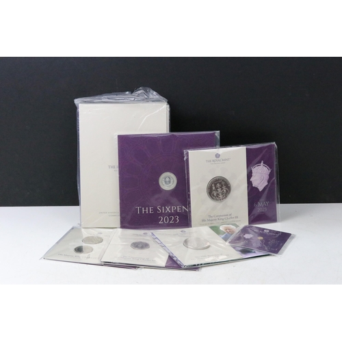 49 - A collection of British Royal Mint King Charles III coin sets to include sixpence, £5, 50p, 1/40oz g... 