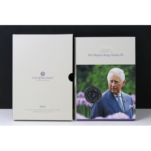 49 - A collection of British Royal Mint King Charles III coin sets to include sixpence, £5, 50p, 1/40oz g... 