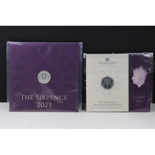 49 - A collection of British Royal Mint King Charles III coin sets to include sixpence, £5, 50p, 1/40oz g... 