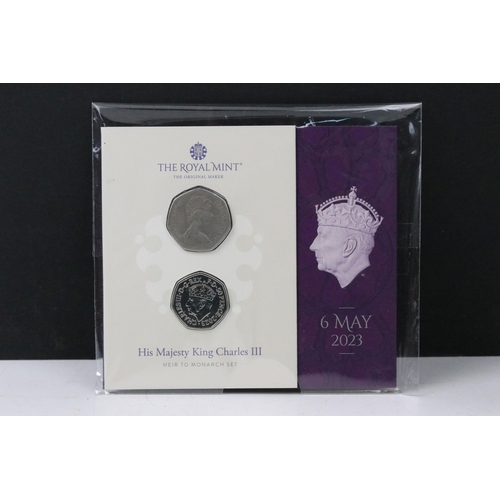 49 - A collection of British Royal Mint King Charles III coin sets to include sixpence, £5, 50p, 1/40oz g... 