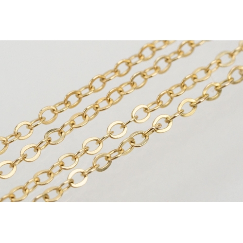 128 - Two 9ct gold fine link necklace chains to include a 9ct gold and sapphire pendant on a rolled gold f... 