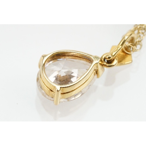 128 - Two 9ct gold fine link necklace chains to include a 9ct gold and sapphire pendant on a rolled gold f... 