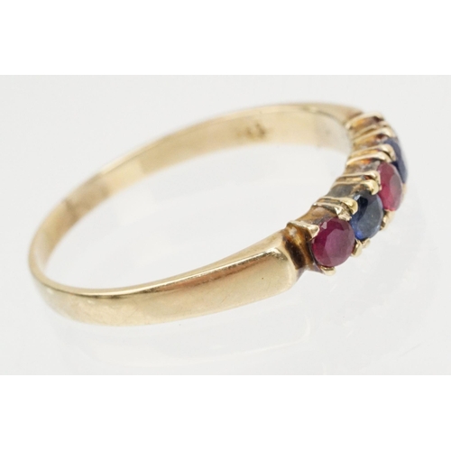 140 - 14ct gold ruby and diamond ring. The ring being set with three round cut rubies and two sapphires. M... 