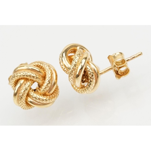 144 - Four pairs of 9ct gold earrings to include a pair of twist design hoop earrings (marked 375 to posts... 