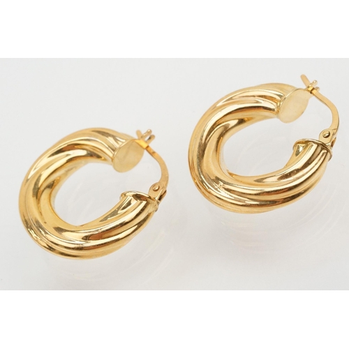 144 - Four pairs of 9ct gold earrings to include a pair of twist design hoop earrings (marked 375 to posts... 