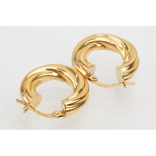 144 - Four pairs of 9ct gold earrings to include a pair of twist design hoop earrings (marked 375 to posts... 