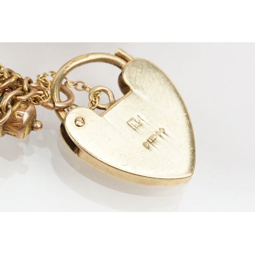 15 - 9ct gold curb link charm bracelet with heart padlock clasp. Together with 18 9ct gold hallmarked cha... 