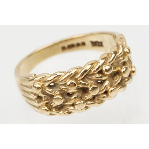 152 - 9ct gold keepers ring with knotted design head. Hallmarked Sheffield 1989. Size L.5.