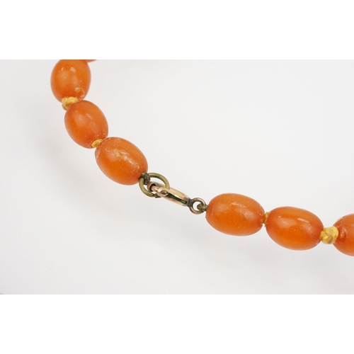 156 - Copal amber necklace having graduated oval beads with matching large pendant. Necklace measures 30 i... 