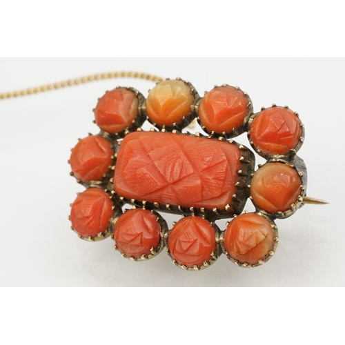 18 - Two 19th Century Victorian brooches to include a carved coral mourning brooch with hairwork panel to... 