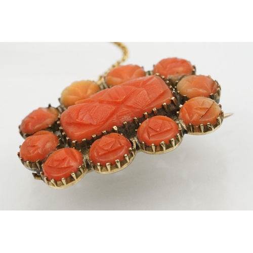 18 - Two 19th Century Victorian brooches to include a carved coral mourning brooch with hairwork panel to... 