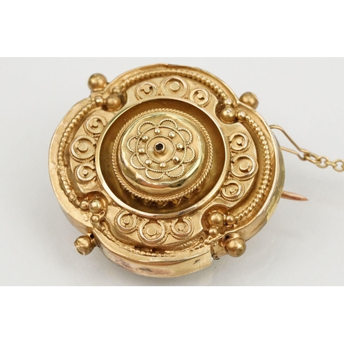 19 - 19th Century Victorian mourning brooch of round form decorated with scrolled details with vacant gla... 